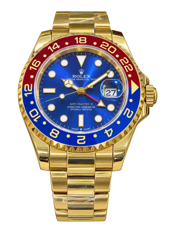 Montre dorée à cadran bleu et lunette rouge et bleue