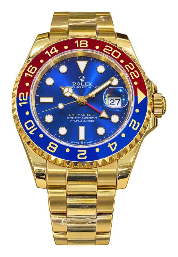Montre dorée à cadran bleu et lunette rouge et bleue